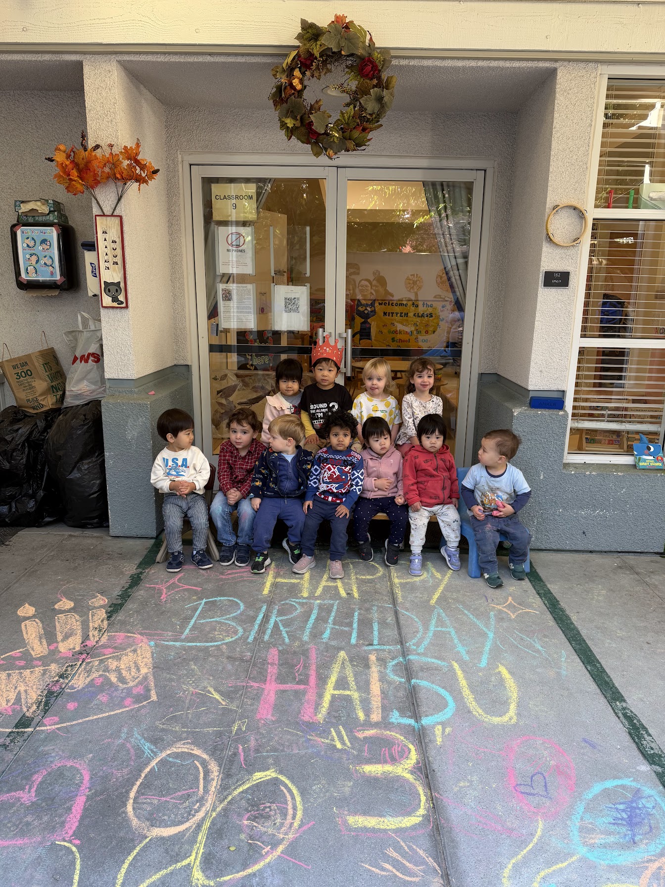 UPNS children and families celebrating a school birthday and community gathering
