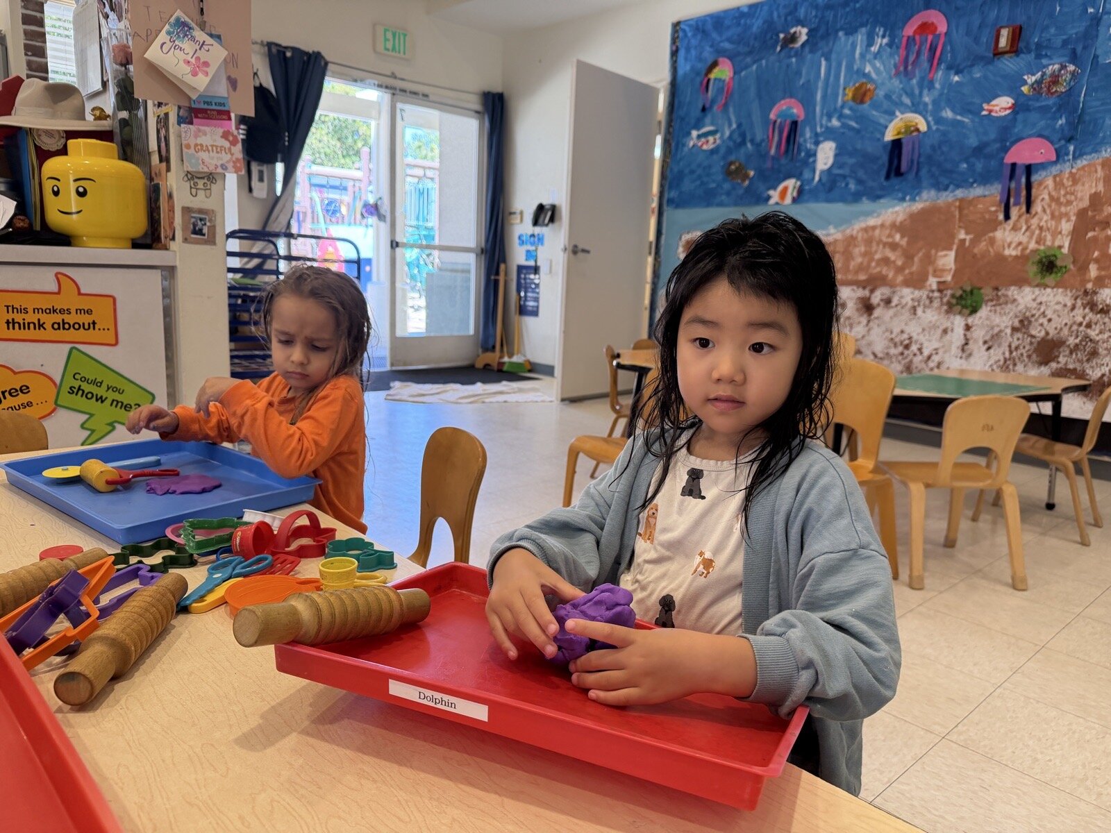 Children in the Dolphin Room engaging in classroom activities