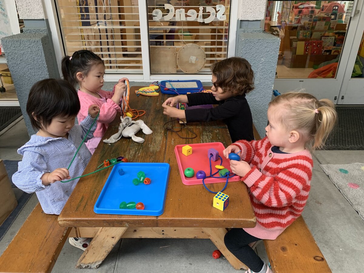 Kangaroo Room children exploring indoor table tray activities