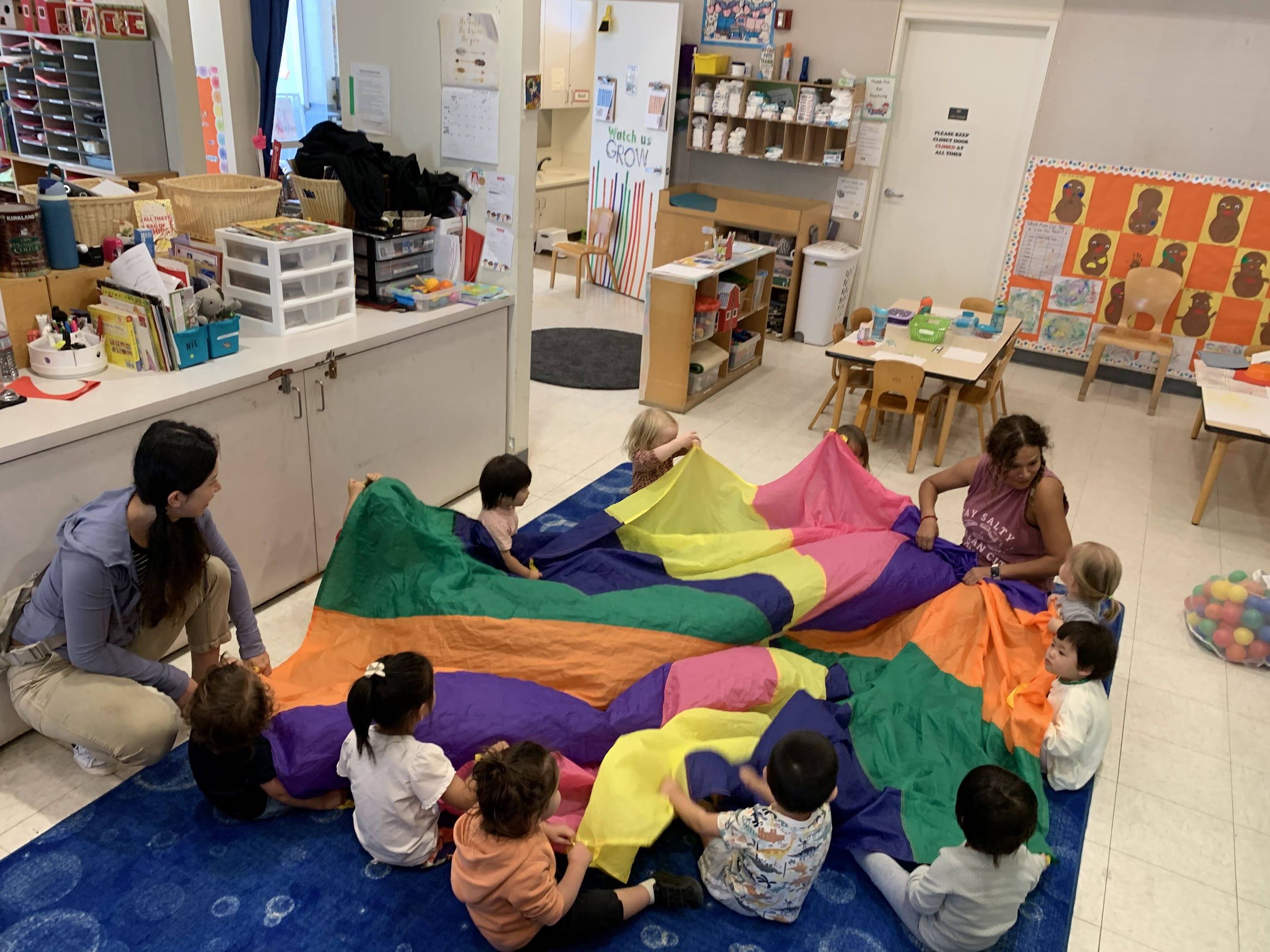 Toddlers dancing and enjoying music in the Kitten Room