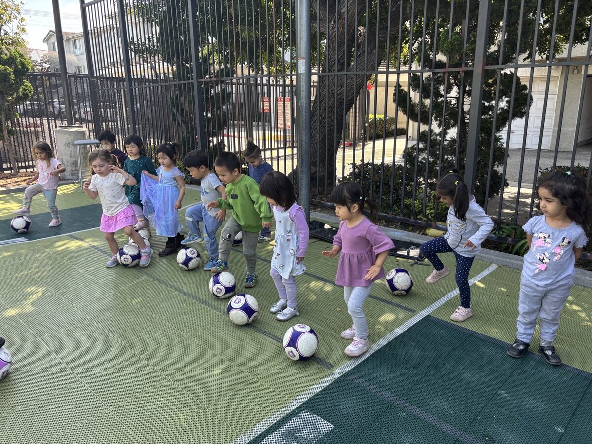 Children running and playing during weekly soccer enrichment class