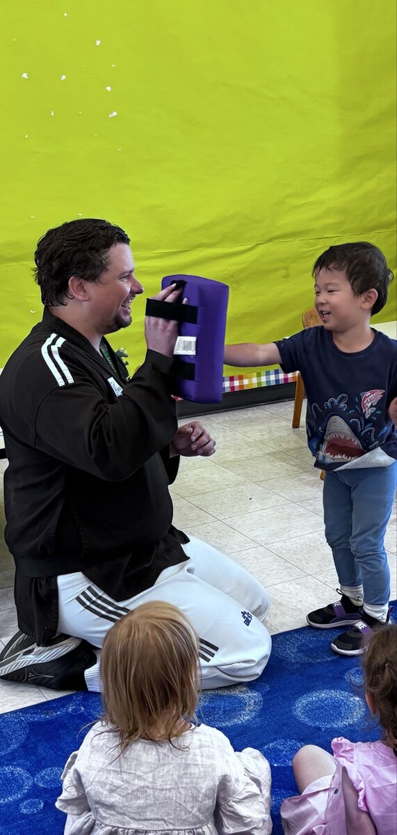 Children practicing balance and focus during weekly Taekwondo class