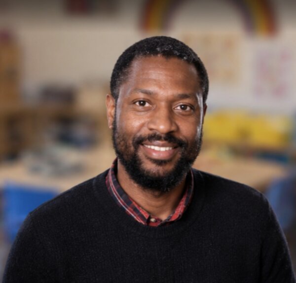 Portrait of UPNS teacher Kareem Smith in the classroom environment