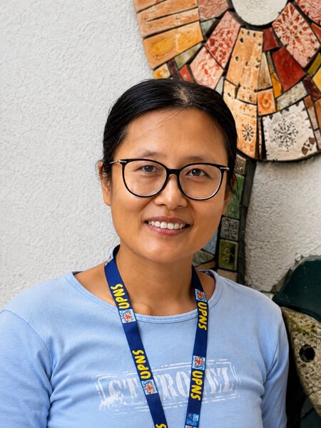 Portrait of UPNS teacher Lin Han in the classroom environment