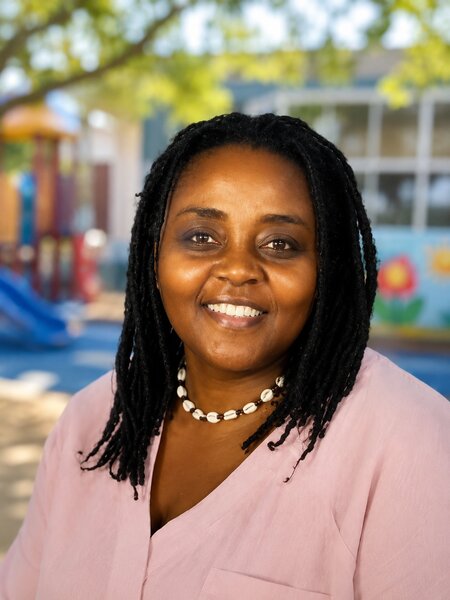 Portrait of UPNS teacher Sulamithe Ello in the classroom environment